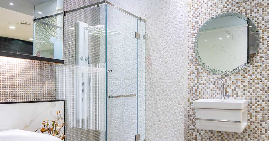 A glass shower in an elegant bathroom