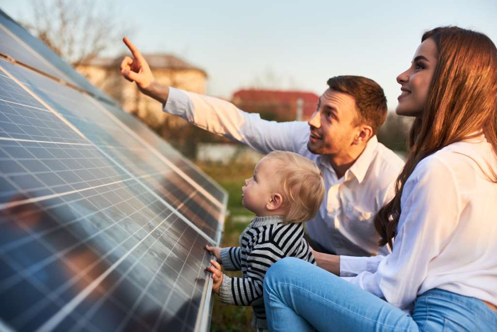 A family looking at their solar panels. 