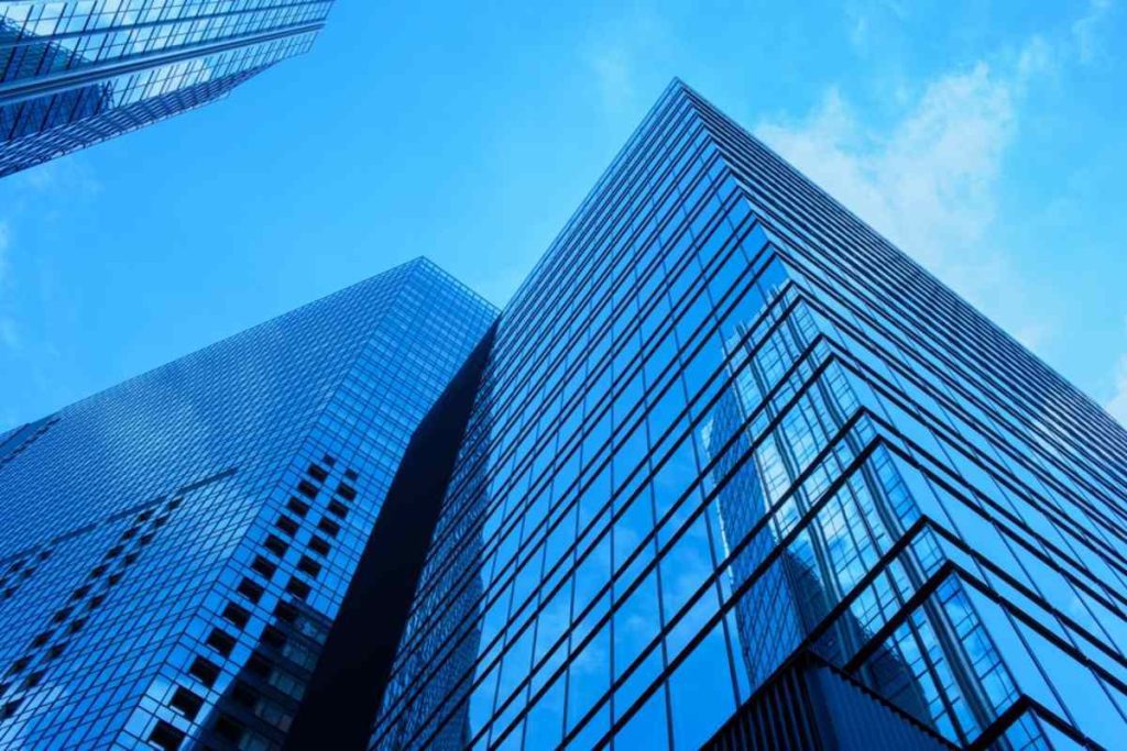 A view up at a glass and steel building.