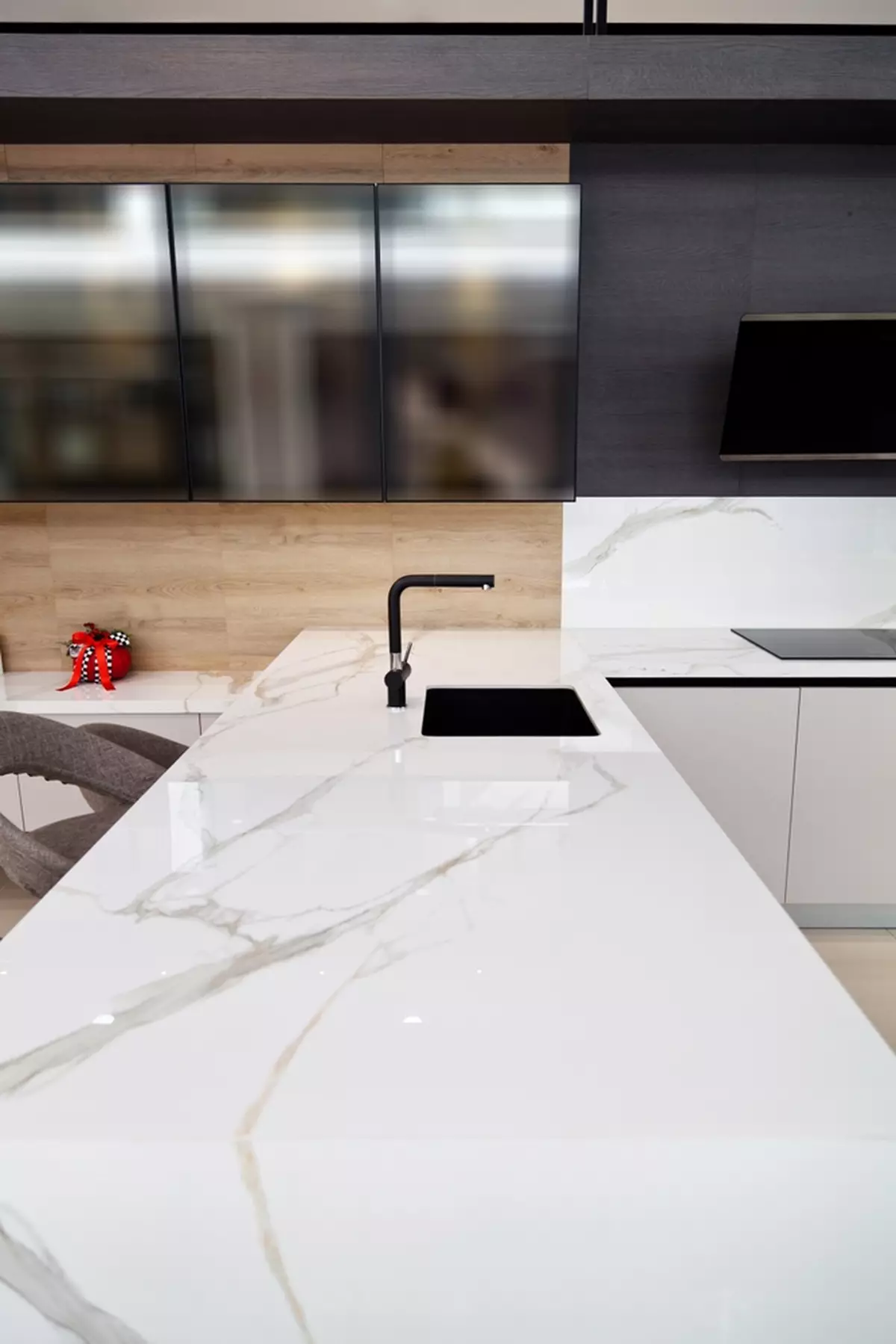 A long white granite countertop with a sink.