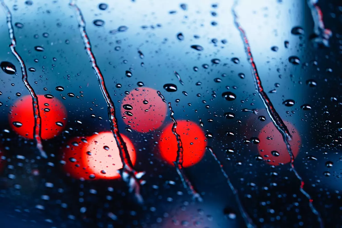 Raindrops and condensation on a windshield.
